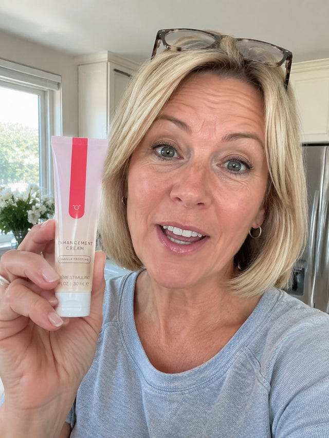 Jane holding the OhMinx tube in her kitchen